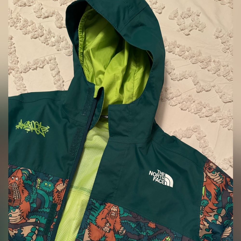 Green North Face rain coat
